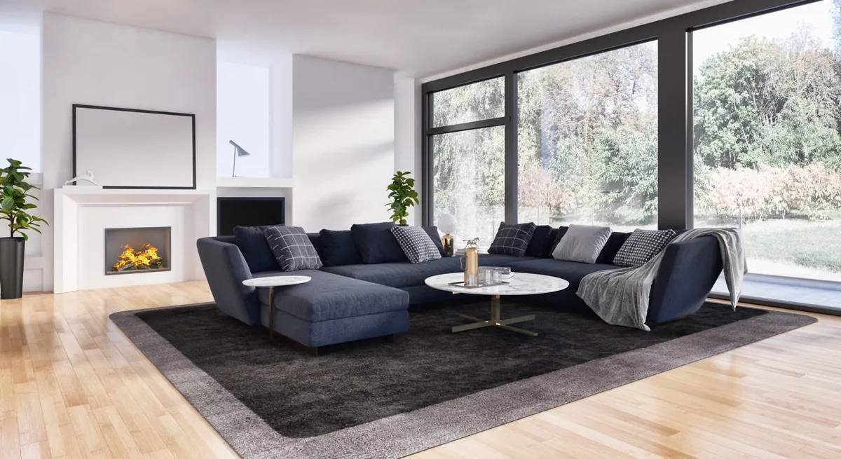 Modernes Wohnzimmer mit großer Glasfront und Kamin. Hochwertige Fenster von NORTA für ein lichtdurchflutetes Ambiente.